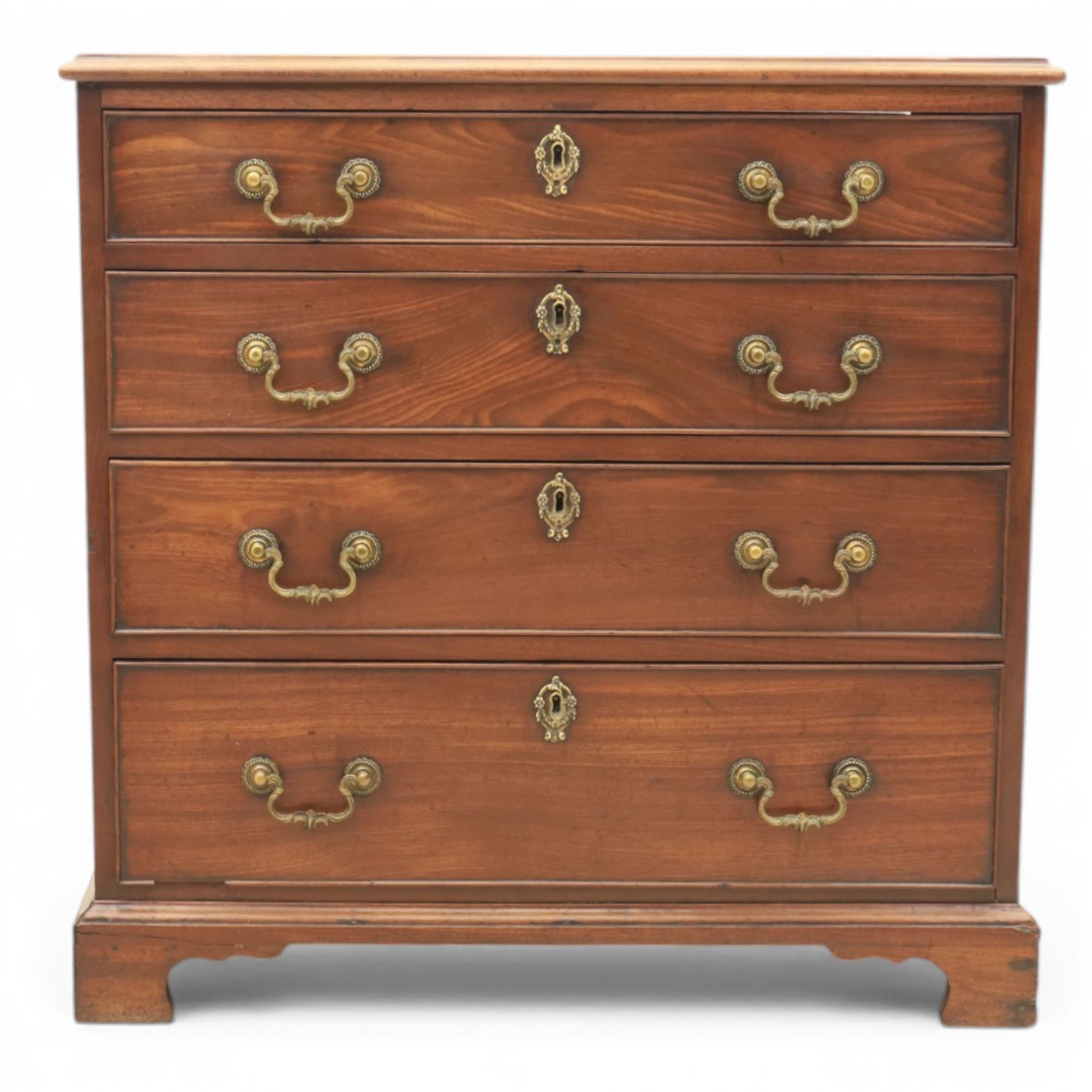 Georgian mahogany dwarf chest of drawers, the moulded rectangular top over four graduated drawers, fitted with brass drop handles, upon shaped bracket feet