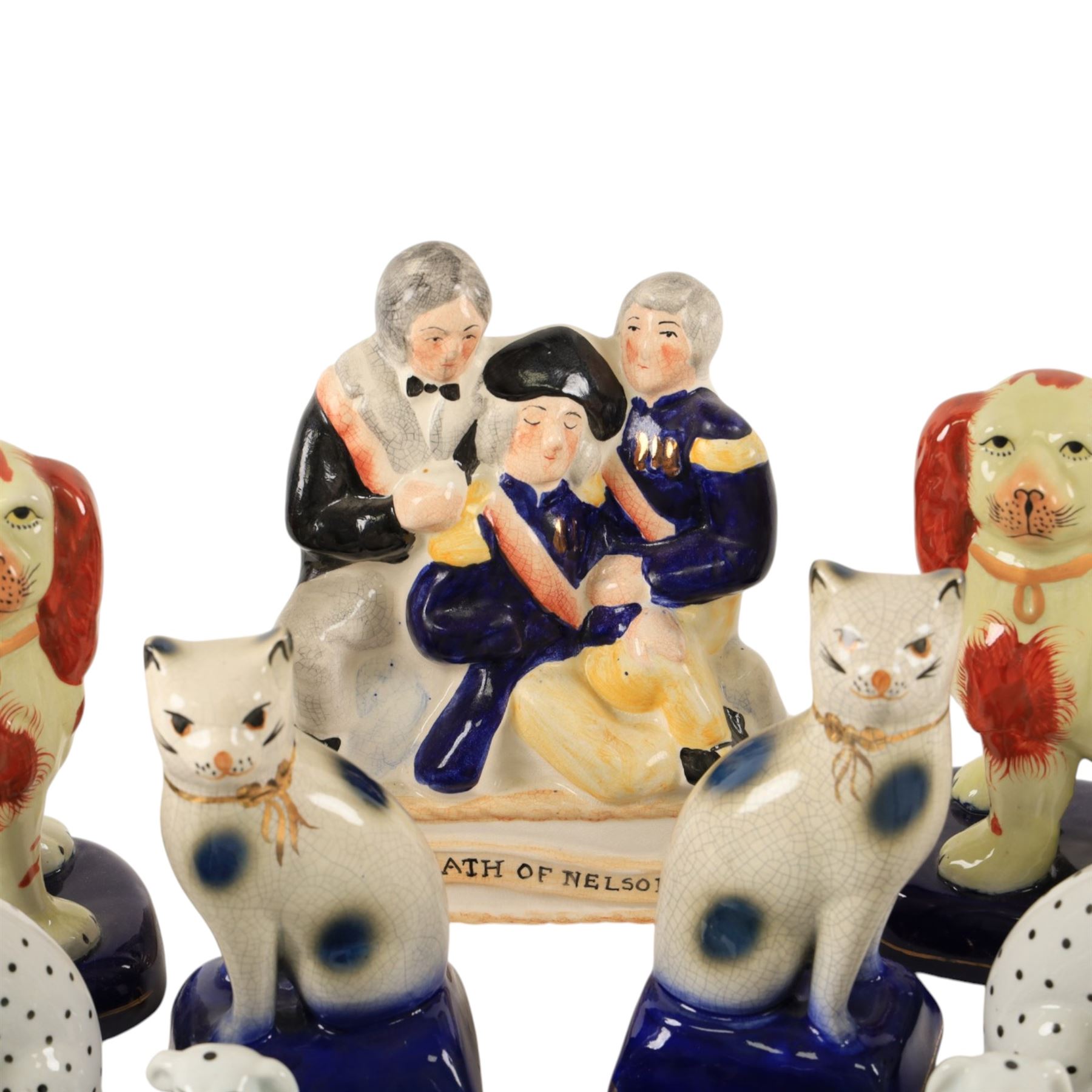 Collection of Staffordshire style figures, including dogs, cats, Death of Nelson etc 