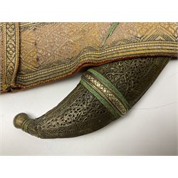 Late 19th century Yemeni Tuza jambiya as worn by religious elite, the 20.5cm curving blade with raised medial ridge, the horn hilt with pique style studwork, in a leather wrapped wooden scabbard with pierced metal mount and leather belt applied with embroidered 'gold' and 'silver' thread work panel; dagger L36cm overall, belt L84cm
