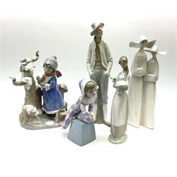 A group of five Lladro figures, to include Winter Frost model no 5287, H25.5cm, a Harlequin figure, girl with lamb, etc. 