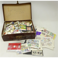  Collection of World stamps on and off paper including some mint stamps, 1972 Olympic stamps, Jersey mint stamps, mixed World kiloware etc, in a small suitcase  