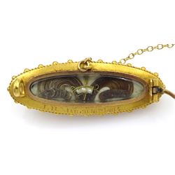 Edwardian gold black onyx brooch, with applied gold pearl set star, the glazed back with hairwork and engraved 'JB March 10th 1904', 18ct gold split pearl oval brooch and a gilt malachite brooch