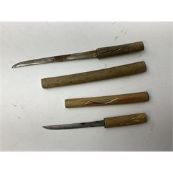 Malayan Kris dagger, the 31.5cm double edged straight heavy damascus blade with copper ferrule; carved hardwood grip; in large wooden throated scabbard with floral decorated white metal covering L47.5cm overall; a kris blade with adapted antler grip; and five various small daggers/letter openers (7)