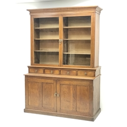  Edwardian oak glazed bookcase on cupboard fitted with drawers and collectors slides enclosed by two panelled doors, W142cm, H194cm, D57cm  