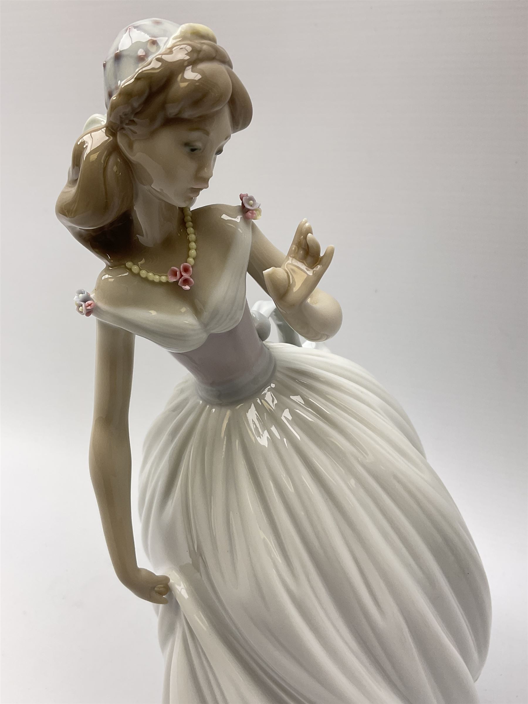 Large Lladro Figures, Spring Splendor, designed by Regino Torrijos, model number 5898, H30.5cm, the glass slipper, designed by Jose Puche, model number 5957, H29cm and Breathless, designed by Juan Ignacio Aliena, model number 6430, H31cm.