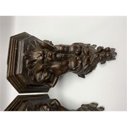 Pair 19th century carved oak wall brackets, each with canted top with carved support in the form of a Green Man mask flanked by two caryatid, and scrolling foliate terminal, H29cm