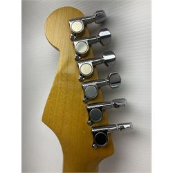 Japanese Squier Fender 'Hank Marvin' Stratocaster electric guitar, c1992, in Fiesta red with tremolo arm and facsimile signature decal; serial no.L037281, L98cm; in hard carrying case.