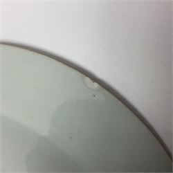 Three 18th century Chinese Famille Rose plates, the first example enamelled with blossoming peonies, rockwork and fence, the other two examples of similar design, decorated with blossoming peonies and sprigs within shaped inner borders, each approximately D23cm