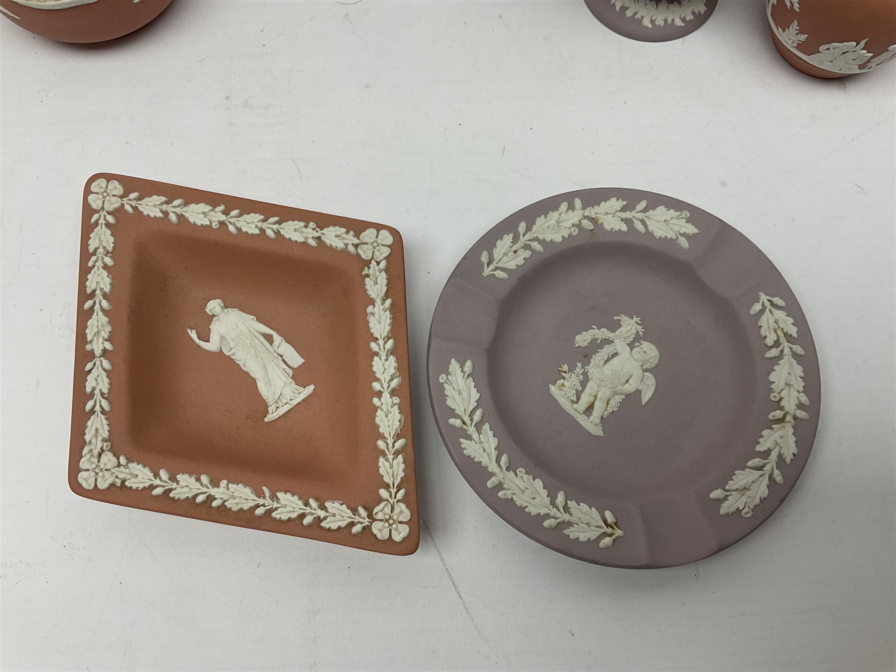 Collection of Wedgwood Jasperware, in orange, lilac and pink colourways, including oval tray, small jug, trinket boxes, trinket dishes, etc , all with impressed mark beneath