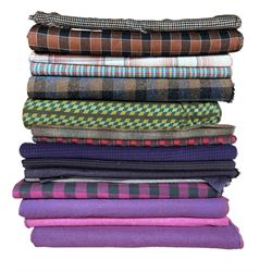 Haberdashery Shop Stock: Tartan, Dogtooth and other rolls of patterned fabrics including poly acrylic, wool mixtures and others 