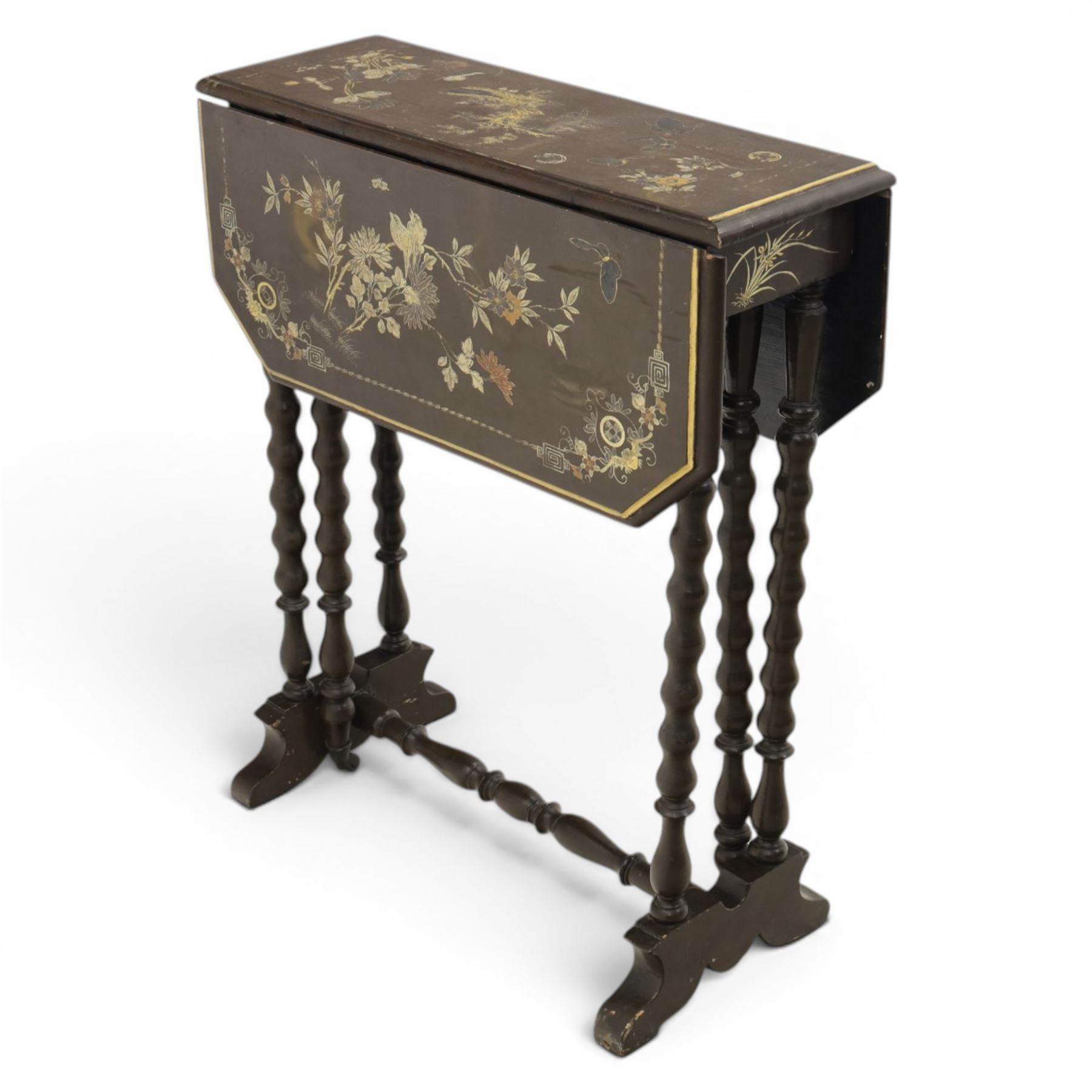Chinoiserie style gate leg table, with gilt painted floral design, raised on bobbing supports, on sled feet