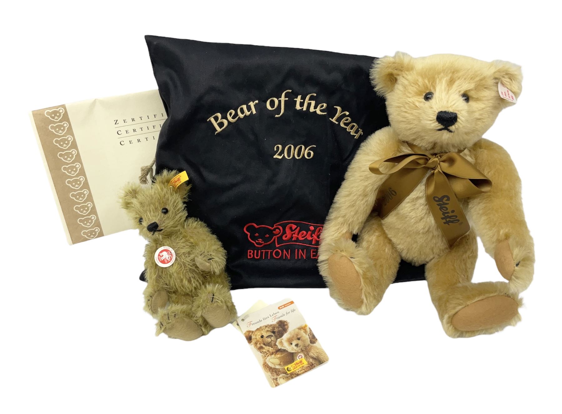 Two Steiff teddy bears comprising 2006 Bear of the Year limited edition with original dust bag and certificate and Big Foot Bear serial no. 002939 both with tags in ear Decorative