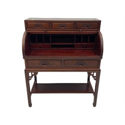 Hardwood cylinder desk, three drawers raised over curved lid, fitted interior with slide, the supports joined by undertier with fret work brackets 