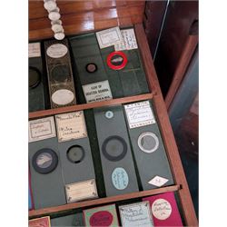 Victorian collector's specimen cabinet, containing a number of prepared microscope slides including miniature photographs, animal and human pathological, physiological and histological specimens and botanical specimens, mostly annotated in ink, the cabinet with glazed door, the drawers with bone handles and lined with green felt, owned by Dr Arthur Bristow, together with a picture of the doctor, cabinet H43cm