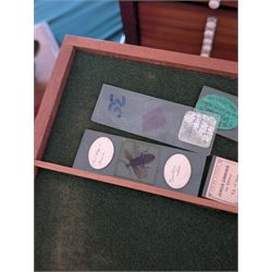 Victorian collector's specimen cabinet, containing a number of prepared microscope slides including miniature photographs, animal and human pathological, physiological and histological specimens and botanical specimens, mostly annotated in ink, the cabinet with glazed door, the drawers with bone handles and lined with green felt, owned by Dr Arthur Bristow, together with a picture of the doctor, cabinet H43cm