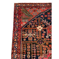 Persian Farahan rug, red and blue ground, the field divided into section with stylised flower head decoration, repeating border with overall floral design