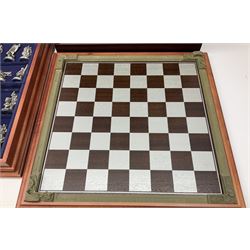 Danbury Mint 'The Fantasy of the Crystal' chess set consisting of mythical pewter chess pieces within a wooden case with chess board lid, together with 16 additional chess pieces in a wooden display case.