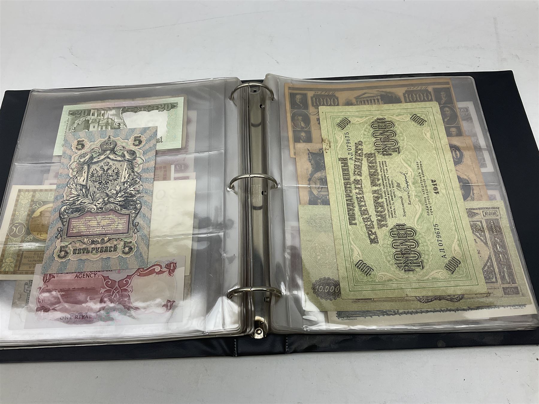 World banknotes, including Queen Elizabeth II The States of Jersey one pound 'DB202703', five pounds 'BB527762' and ten pounds 'AB651481', reserve bank of New Zealand two dollars '1L3 741894', King George V Straits Settlements one dollar 1st January 1935 'F/83 28924', various Bank of England notes etc, housed in two ring binder albums