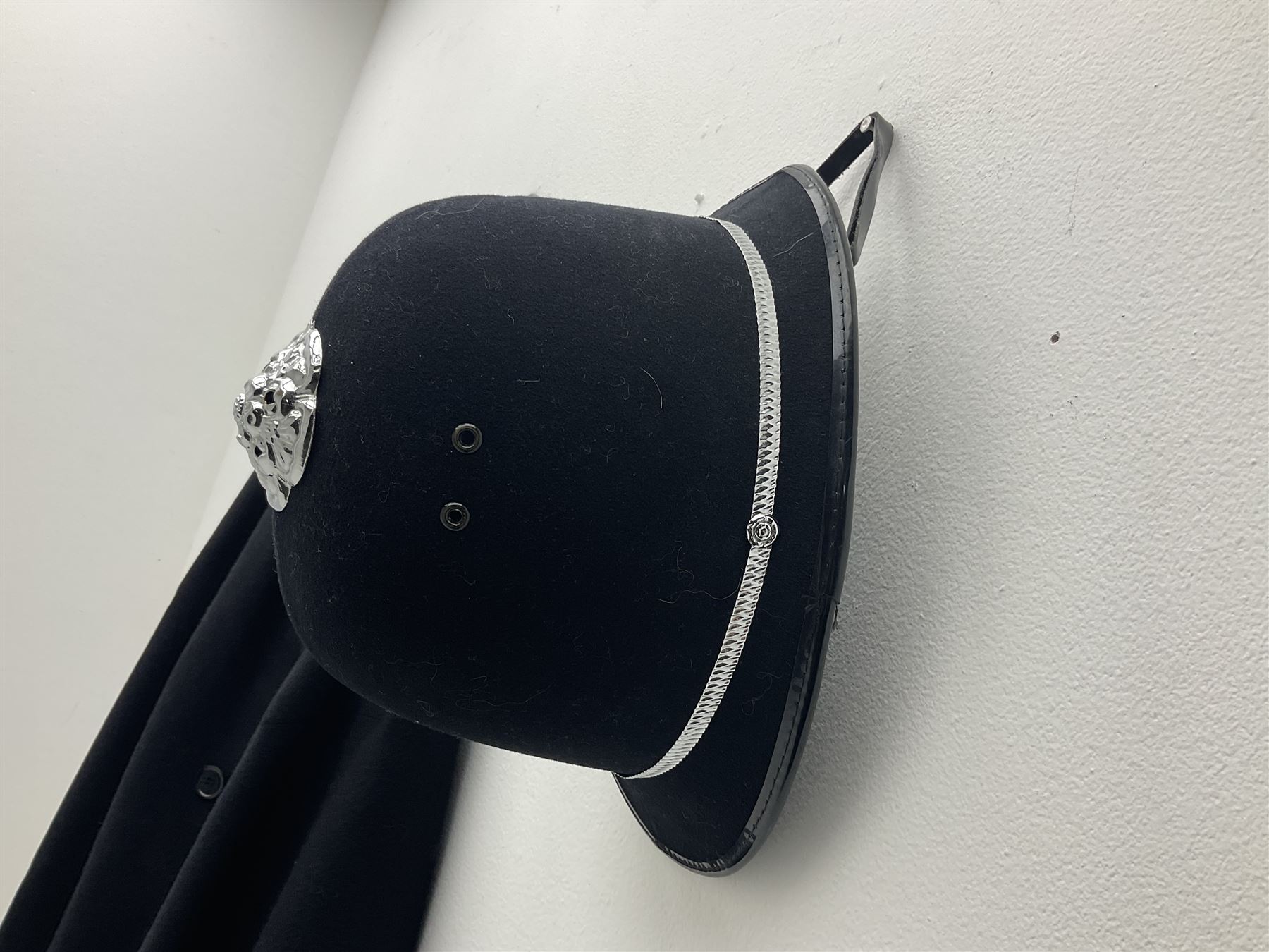 Police Constabulary style uniform items comprising woollen night cape / cloak with chain fastening, helmet and truncheon