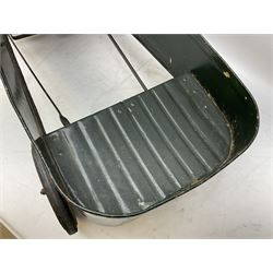 Mid 20th century pressed steel pedal car, the body painted in dark green fitted with pretend radiator to the bonnet, with spoked wheels and rubber tyres, the interior with pedals and steering wheel, L70cm