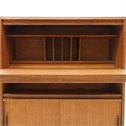 Robert Heritage (1927-2008) for Beaver & Tapley - Mid 20th century teak bureau, fall front with fitted interior, above a sliding door cabinet, raised on short supports