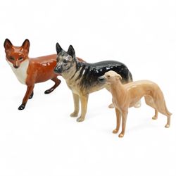 Six Beswick dogs comprising St Bernard No.2221, Greyhound No.972, Alsatian No.969. Whippet No.1786B, Cairn No.1055A and Retriever No.1855, two Beswick foxes and a harnessed horse