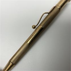 9ct gold propelling pencil, with engine turned decoration and engraved rectangular cartouche, hallmarked E Baker & Son, Birmingham probably 1946