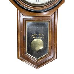 American - Late 19th century Ansonia 8-day wall clock, with a hexagonal wooden dial surround and circular spun bezel, glazed case door and visible pendulum,  two part dial with Roman numerals, minute track, spade hands and seconds dial, twin train spring driven movement striking the hours on a gong.