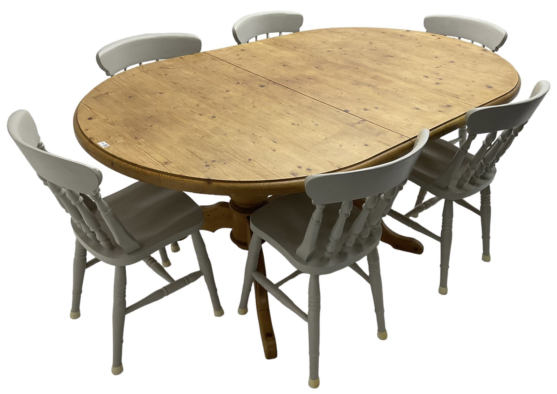 20th century pine extending dining table, oval top over twin bulbous turned pedestal base united by stretcher, with additional leaf (W160cm D120cm H79cm); and set of seven ash painted dining chairs, spindle back, raised on ring turned supports joined by H-stretcher