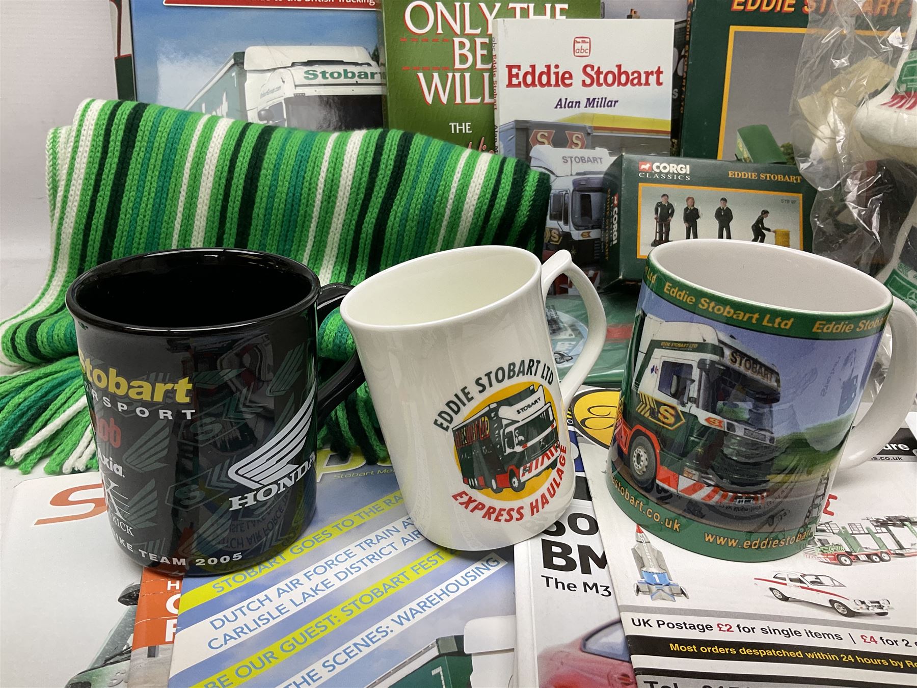 Eddie Stobart - accessories, memorabilia and promotional merchandise including Corgi Self Assembly Model Transport Depot and Five Figures Set; scarf; slippers; mugs and beakers; coasters; note book; books etc