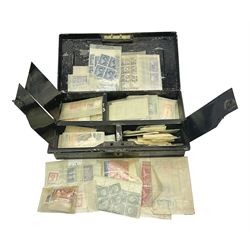 Great British and World stamps in packets, including New Zealand, Australia, Hong Kong, South Africa, Malta, Nigeria etc, housed in a vintage cash tin