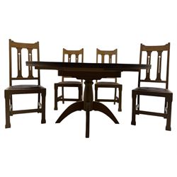 Contemporary light oak round extending dining table with four chairs, table has fold out leaf attached underneath on four out-swept legs, Oak chairs with straight top rail over twin slat back with pierced motifs, brown leather seat with brass studs, square legs joined by plain stretcher 