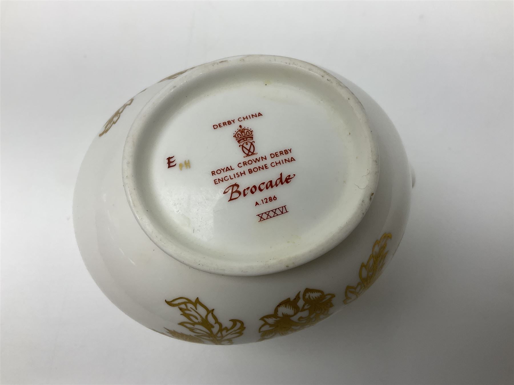 Royal Crown Derby Brocade pattern jug and sugar bowl, together with a similar gilt floral pattern bowl, three graduating Staffordshire style pearlware cottage jugs, Leeds Pottery model cottage and other ceramics and glassware, etc