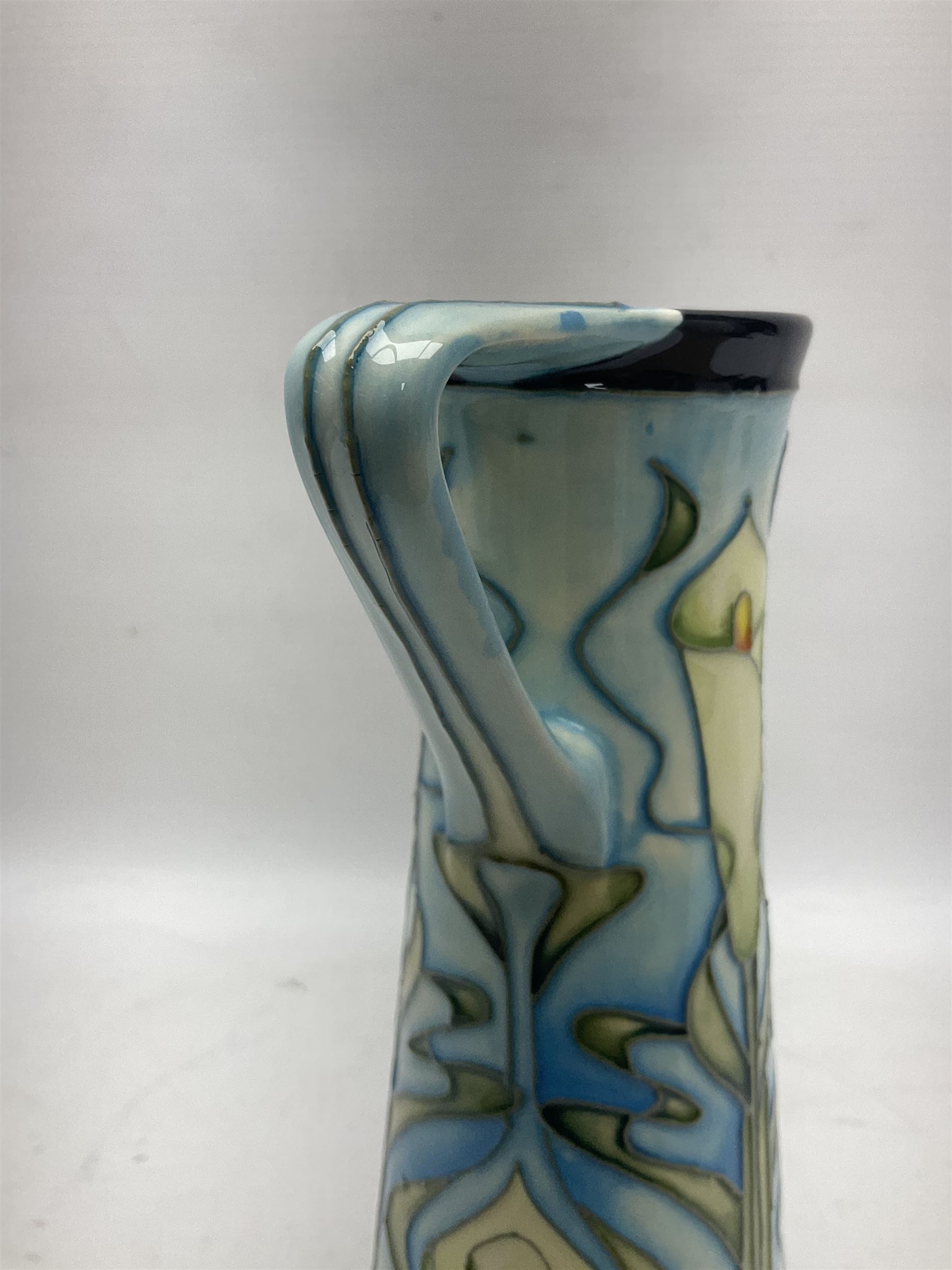 Moorcroft jug, of tapering form, decorated in the Calla Lily pattern by Emma Bossons, circa 2001, H24cm