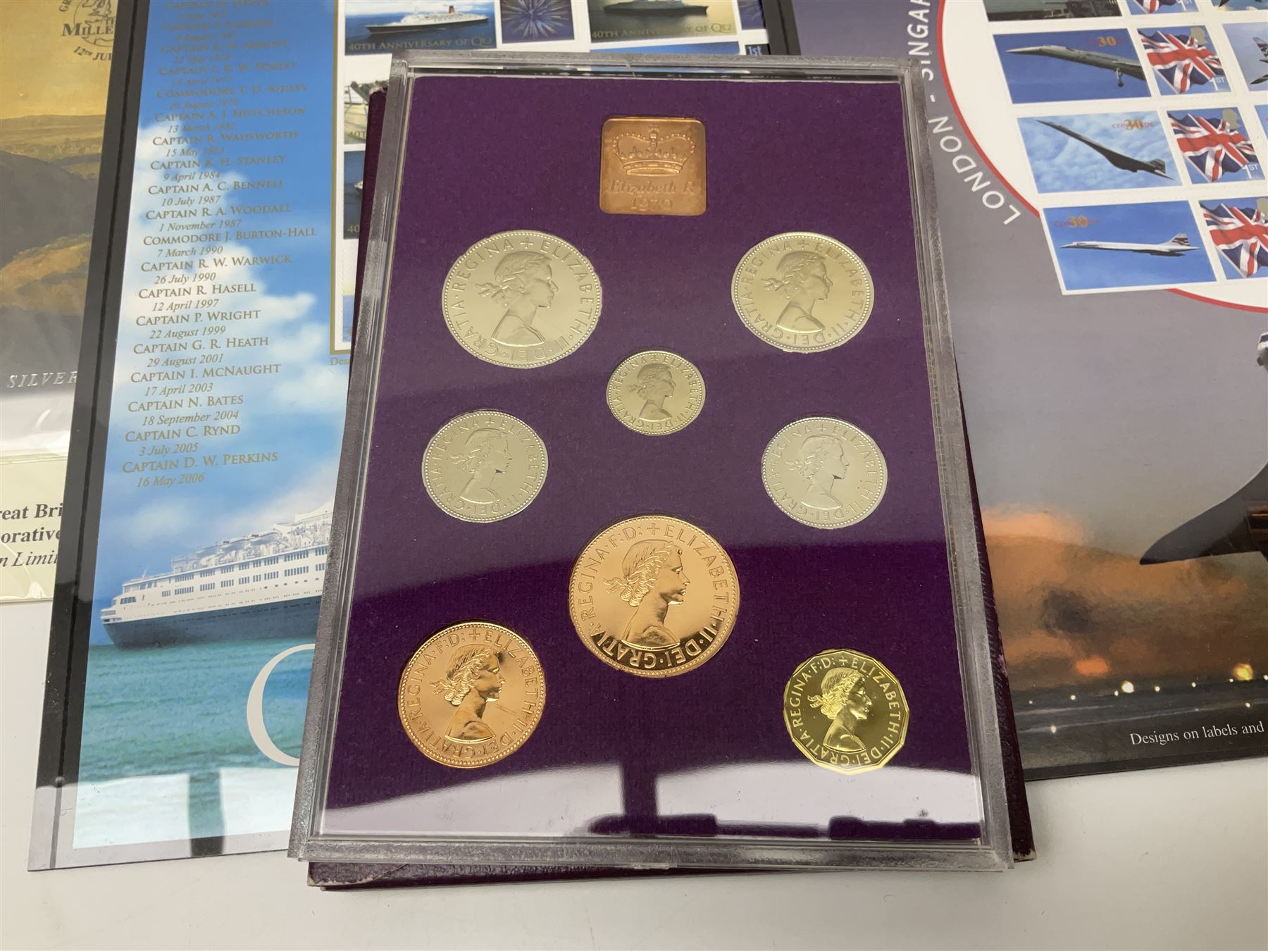 Coins and stamps, including The Royal Mint Great Britain 1970 coin set in plastic holder, 2006 'Brunel' coin cover containing two commemorative two pound coins, Alderney 2006 sterling silver proof five pounds, two 2007 five pound coins in card folders, two limited edition mint first class stamp sheets each comprised of ten first class stamps, various first day covers many with special postmarks housed in 'Royal Mail' boxes etc