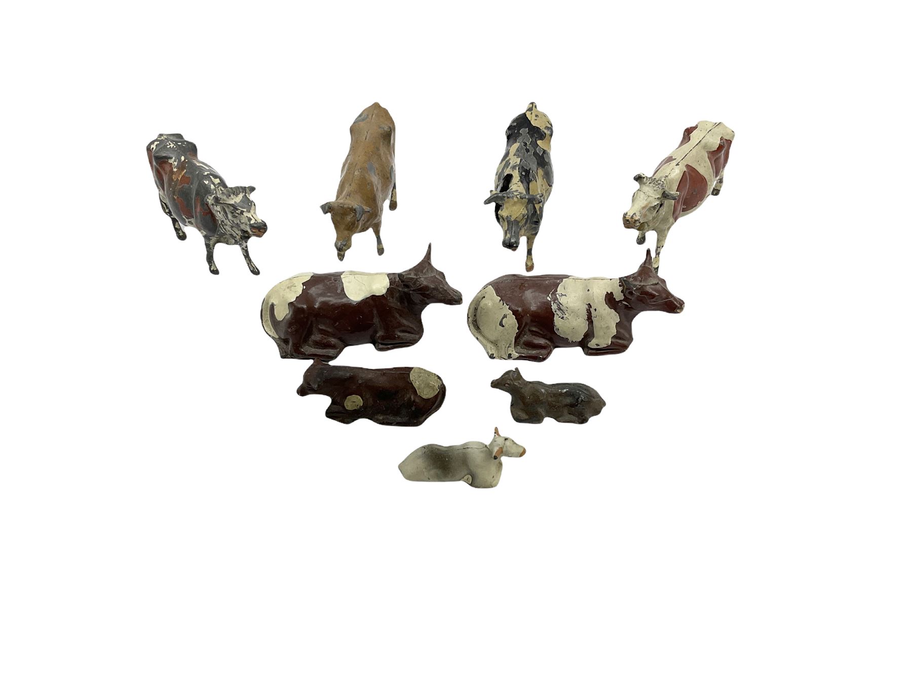 Britains Nestles 'The World's Cow' decorated with map-of-the-world pattern L8cm; and eight other various sized lead figures of cows, standing or reclining, by Britains, Hill & Co etc (9)