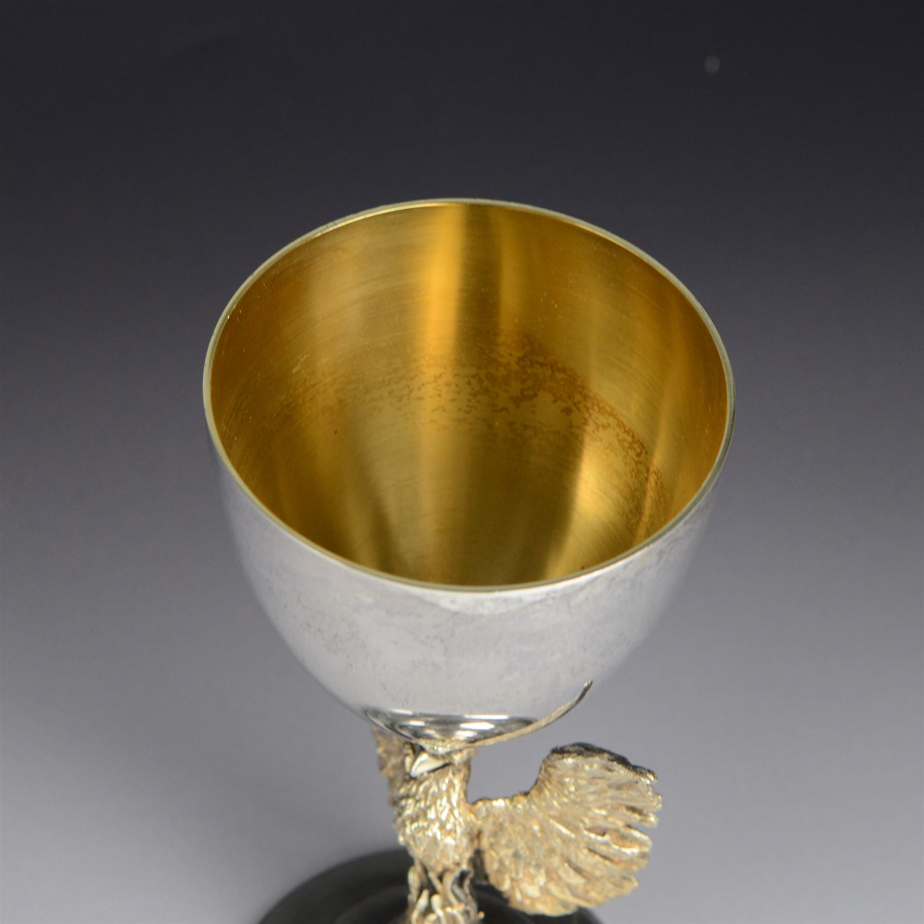 Modern limited edition silver goblet, 'made by order of the Dean and Chapter of St Paul's to commemorate the 300th anniversary of the laying of the foundation stone of the cathedral in 1675', designed by Jocelyn Burton for Aurum, the plain bowl with gilt interior, upon a parcel gilt stem in the form of a phoenix with wings outstretched,  limited edition no. 497, hallmarked Jocelyn Burton, London 1975, H16cm, boxed