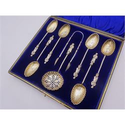 Set of six Victorian apostle top spoons, with sifting spoon, and pair of sugar tongs, each with gilt shell bowl, hallmarked William Devenport, Birmingham 1896, contained in fitted case, approximate silver weight 1.96 ozt (61.1 grams)