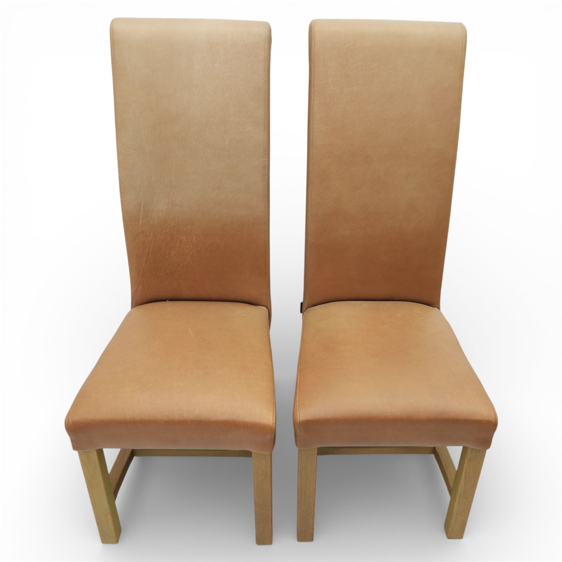 Modern large oak plank top dining table and twelve brown leather high back chairs, table of rustic construction five solid planks with exposed supports, the chairs in brown leather hide with ten standard height and a pair of taller chairs for the foot and head of the table