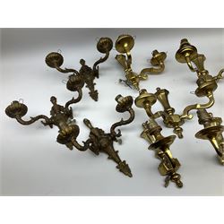 Quantity of brassed twin branched wall sconce lights and similar single light fittings