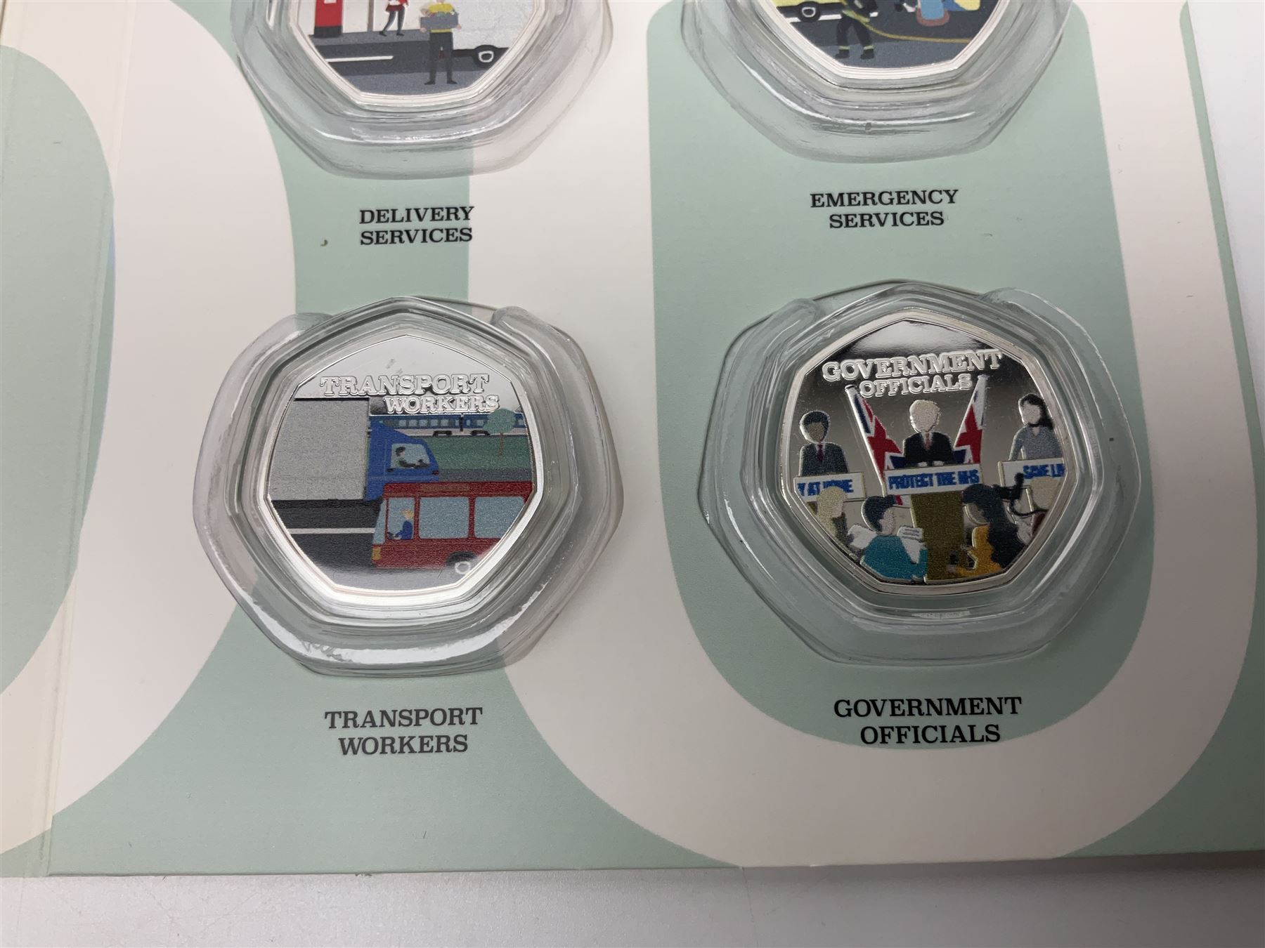 'Thank You To Our Key Workers Official Charity Coin Collection' comprised of fourteen Queen Elizabeth II Samoa half dollar coins including one minted in fine silver, the others being plated, housed in the official folder