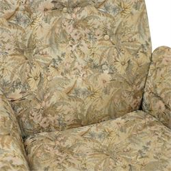 Ercol - golden elm 'Saville' armchair and matching footstool, elm frames with curved back supports and slatted sides, removable cushions upholstered in floral tapestry fabric, footstool (H 39cm, W 59cm)