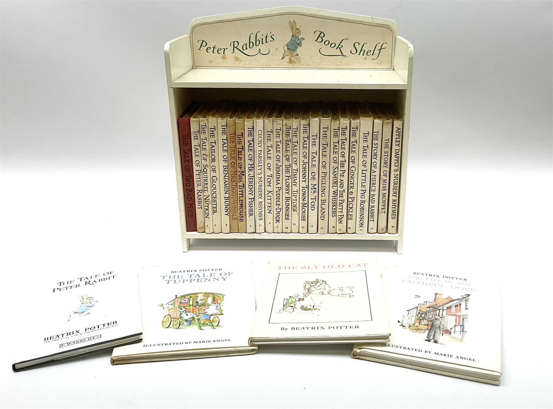'Peter Rabbit's Book Shelf', containing selection of Beatrix Potter books, mostly library editions, shelf H29cm L27.5cm D11.5cm
