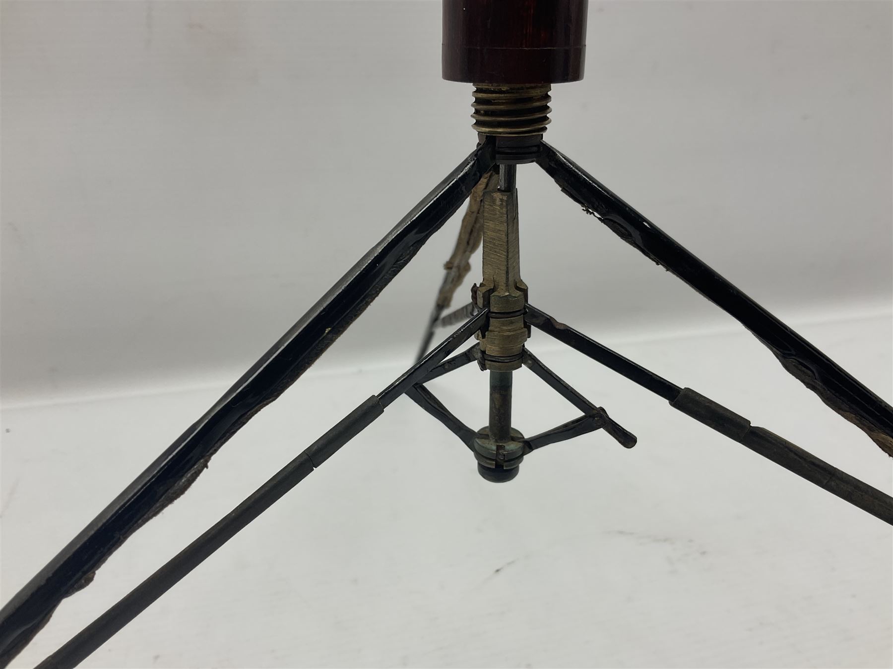 Victorian magician's cane, the mahogany walking stick twisting apart to reveal an internal mechanism, opening to tripod and black silk fold out magician's table, with horn handle and silver mount, hallmarked Birmingham 1891