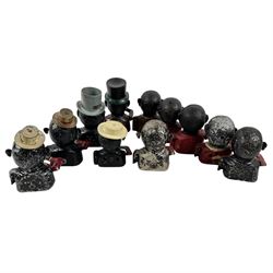 Collection of cast iron Jolly money boxes with and without hats