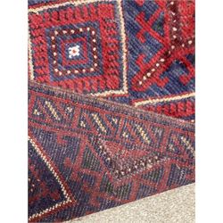 Meshwani runner rug, red and blue ground, repeating medallion and pattern throughout 