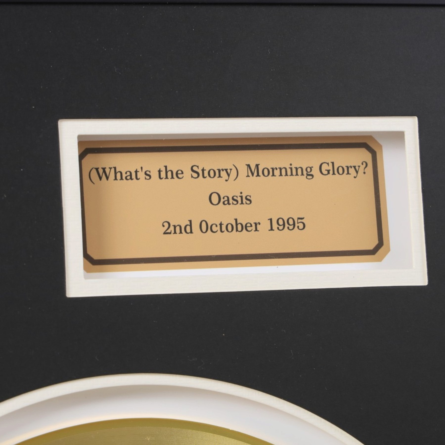 Oasis What's The Story Morning Glory? commemorative gold disc display, featuring gold coloured record, album artwork and track listing, framed and glazed, H40cm, W60cm