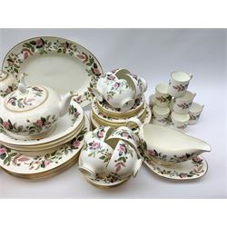 Wedgwood Hathaway Rose pattern dinner and tea wares, comprising eight dinner plates, eight salad plates, eight dessert plates, six side plates, six soup bowls and six saucers, sauce boat and stand, three oval serving dishes, oval serving platter, teapot, coffee pot, eight tea cups and eight saucers, eight coffee cans and eight saucers, two open sucriers, milk jug, cream jug, two ashtrays, and a lidded box and cover. 