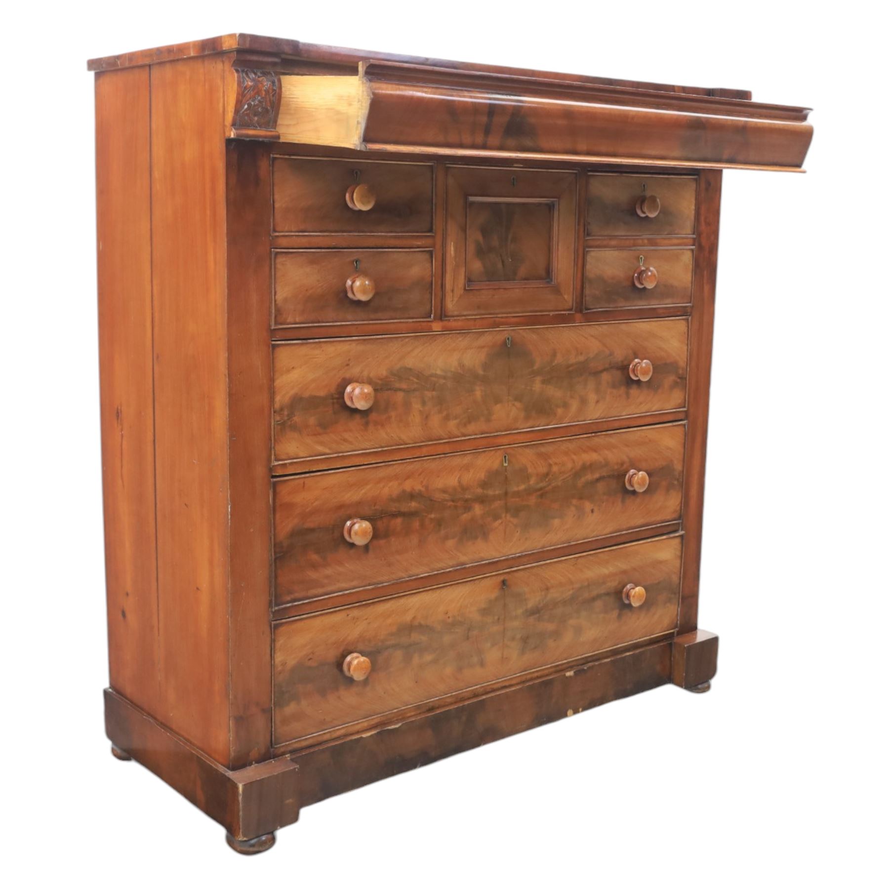 Victorian Scottish mahogany chest, cushion drawer over assorted small drawers and three long drawers, all with flame veneered fronts, turned wooden handles