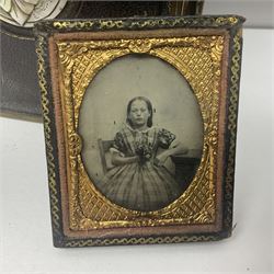 Five Victorian framed Daguerreotypes and a mother of pearl inlaid leather album of Victorian photographs